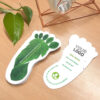 Stack of footprint-shaped plantable business cards with leafy background design