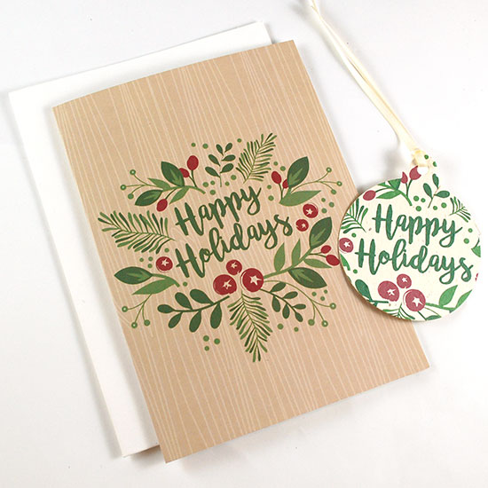 Brimming with greenery and holiday charm, these Happy Holidays Ornament Business Holiday Cards have a beautiful seed paper ornament attached that will grow wildflowers when planted.
