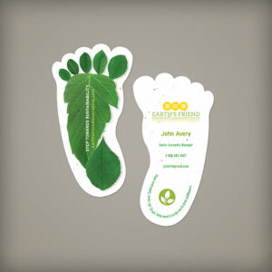 Stack of footprint-shaped plantable business cards with leafy background design