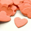 This heart shaped biodegradable confetti in coral makes a great addition to any table decoration.