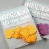 These Modern Confetti Seed Paper Wedding Favors grow beautiful wildflowers when the heart shaped confetti is planted.