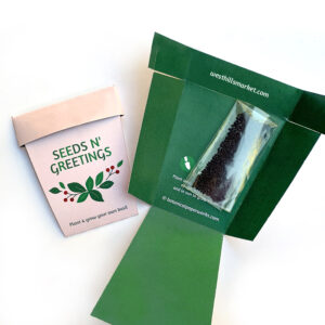 A seed packet shape like a plant pot with the message "seeds n' greetings"