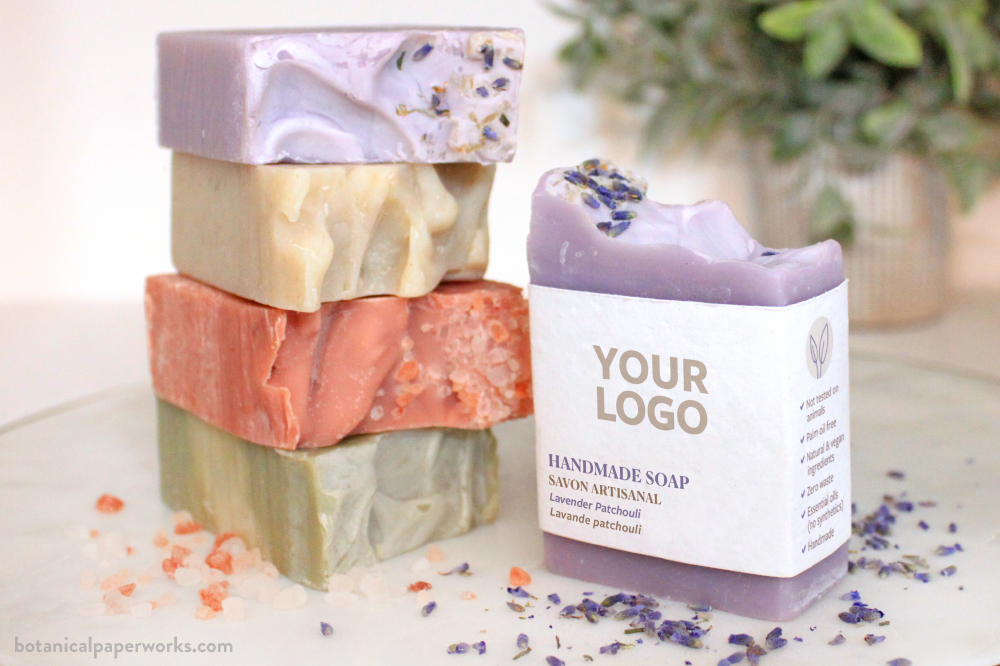 stacked handmade promotional soaps with plantable seed paper wrapping and natural, vegan ingredients