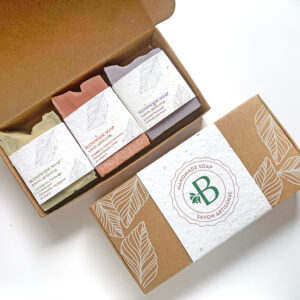 A handmade soap gift set of 3 thick-cut soaps with plantable seed paper labels and a compostable kraft paper box