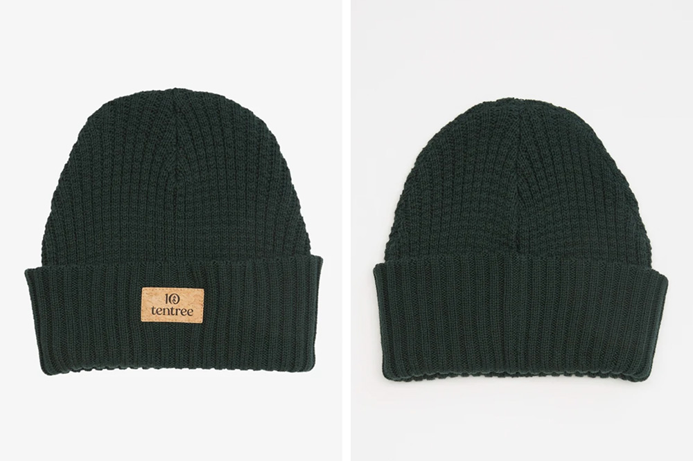 a green beanie made out of cotton