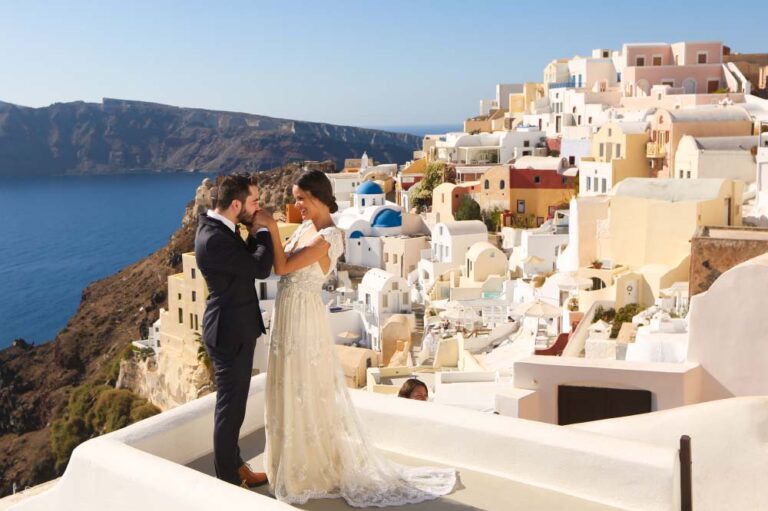 Wedding couple posing on a rooftop in Greece