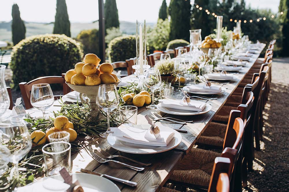 a wedding in Tuscany Italy with lemon bowls as centerpieces in a villa