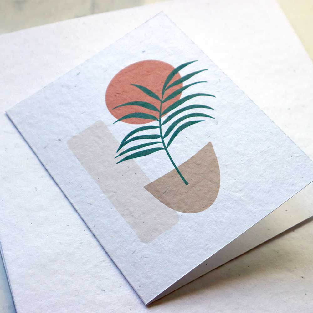 A printed card sample on white handmade paper