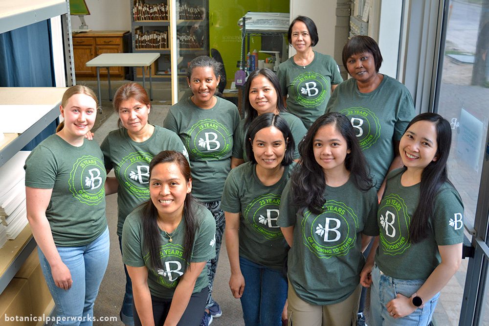 Botanical PaperWorks team members wearing branded t-shirts
