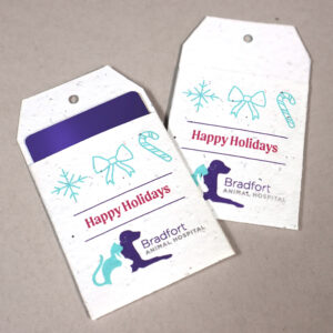 A seed paper gift card holder shaped like a gift tag printed single-sided