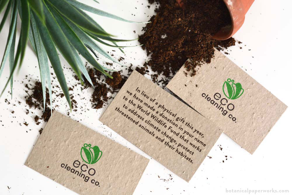 eco natural seed paper business cards for a corporate holiday gift with a message about a donation in the name of the recipient