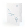 Seed paper thank you card with a minimalist, floral design.