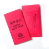 A custom-printed lucky money red envelope with text for Chinese New Year on it