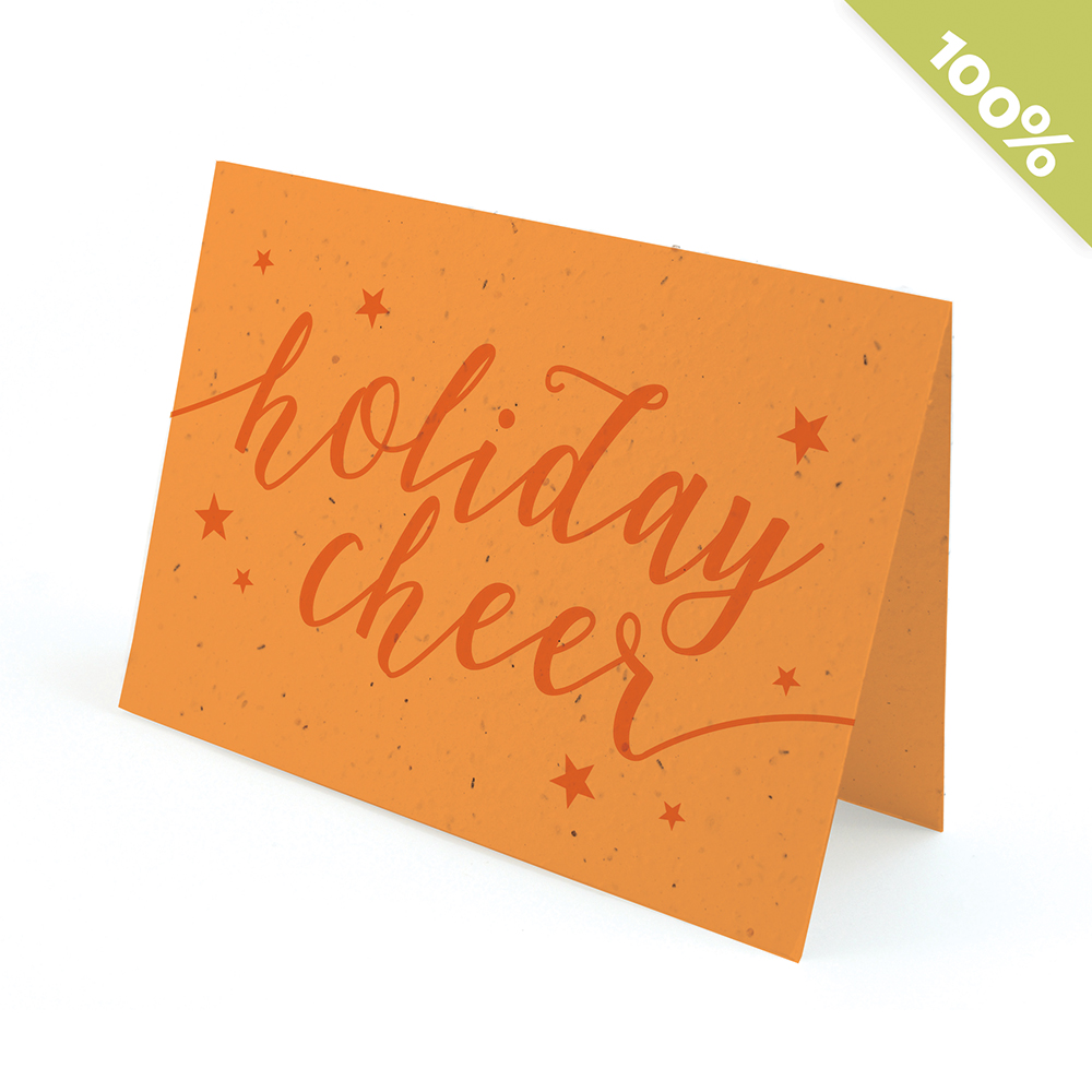 A marigold seed paper holiday with the words 'holiday cheer' in a script font