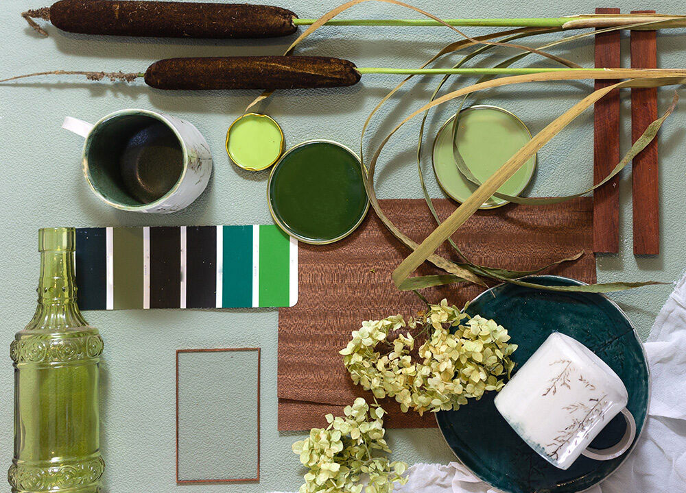 table top filled with various objects in shades of green