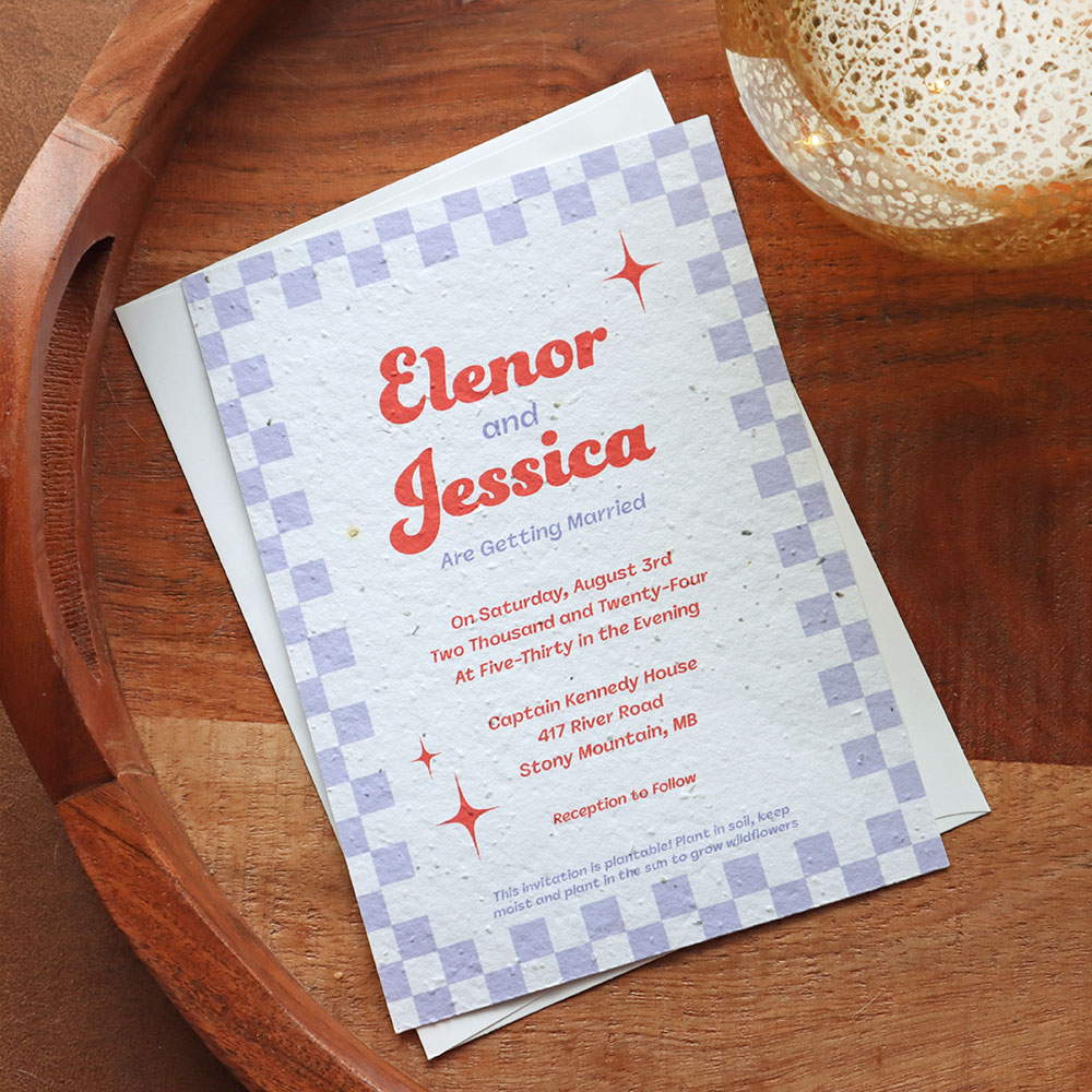 A seed paper wedding invitation with a retro design on a wood grain background
