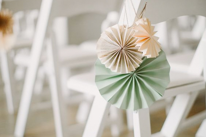 Dress up your wedding ceremory chairs in a simple and sweet way with this paper craft.