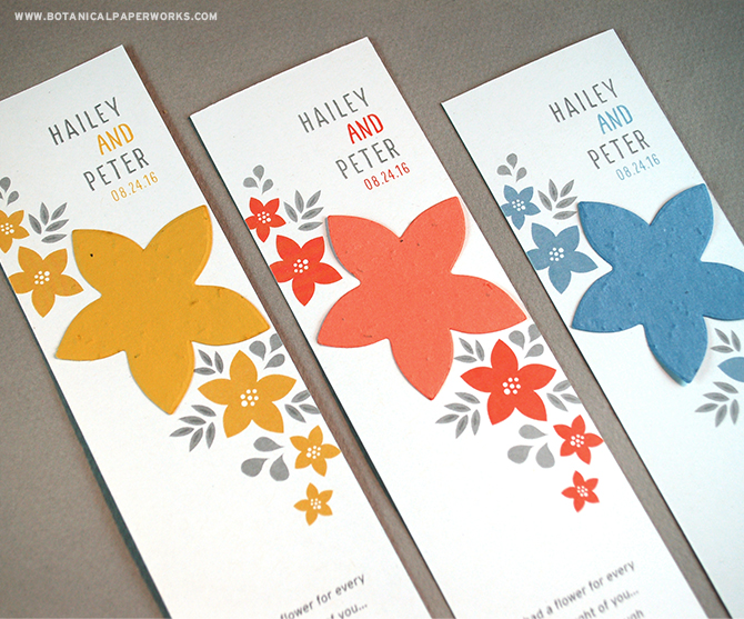 This Floral Bookmark Seed Paper Wedding Favor features a flower seed paper shape that will grow real flowers when planted in soil.