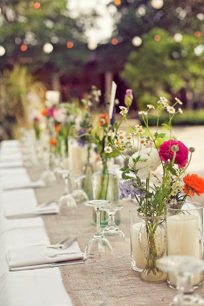 Simple and beautiful, rustically bunched wildflowers are a classic way to display whimsical wildflowers at your #wedding.