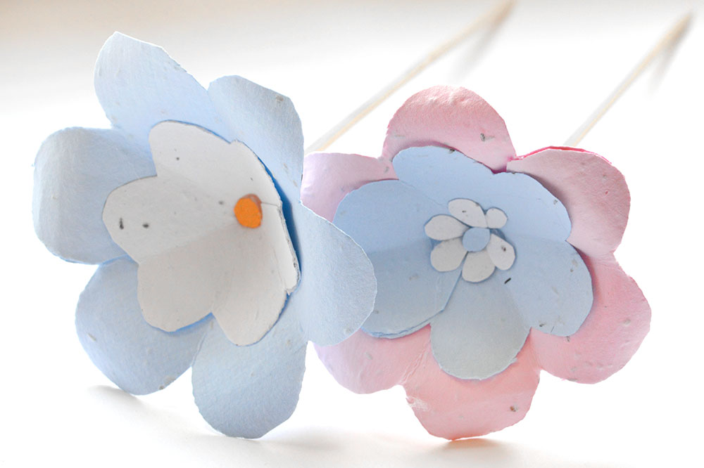 Learn how to make seed paper flowers for summer wedding centerpieces & bouquets in this craft tutorial.